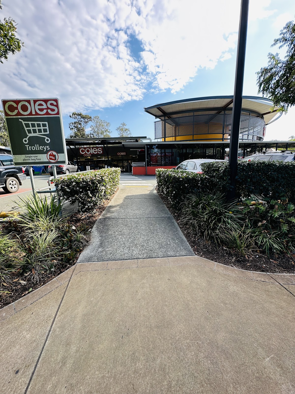 Garden strip beside a shopping centre footpath